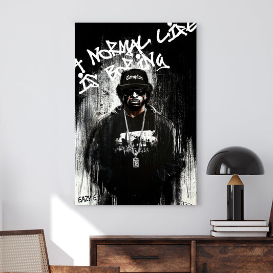 A bold black-and-white graffiti-style wall art print of a hip-hop legend Eaze-E, featuring raw paint drips and rebellious street art typography.