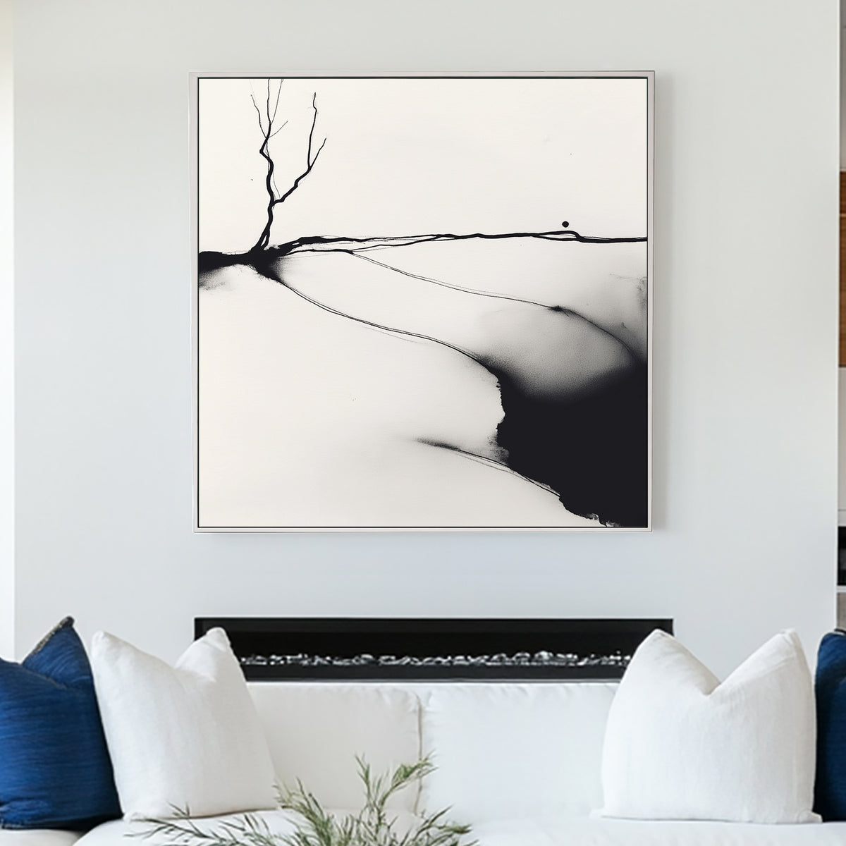 A minimalist black and white ink wall art print of a lone barren tree, set against an abstract landscape with fluid ink washes