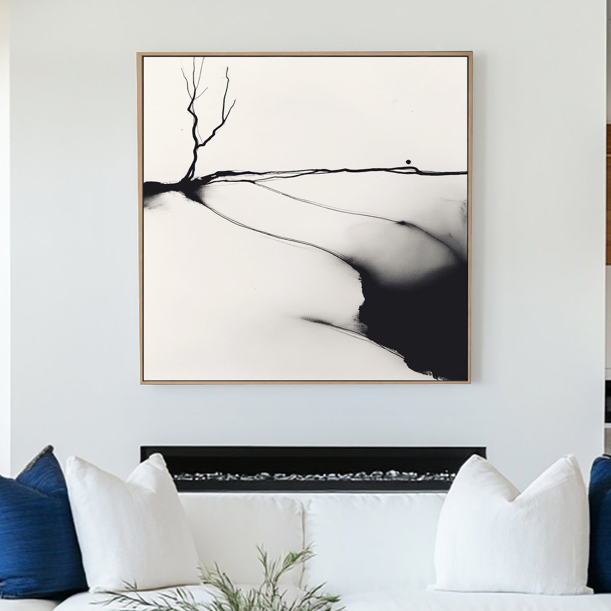 A minimalist black and white ink wall art print of a lone barren tree, set against an abstract landscape with fluid ink washes