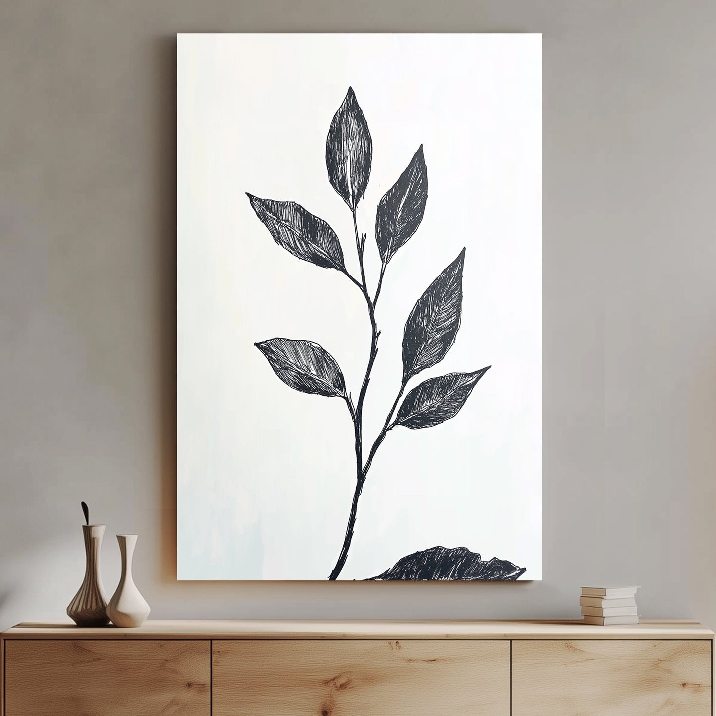 A minimalistic black and white botanical wall art print featuring a delicate hand-drawn branch with leaves, set against a light background