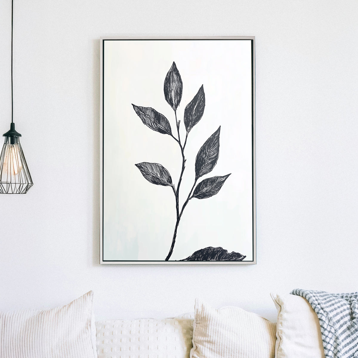 A minimalistic black and white botanical wall art print featuring a delicate hand-drawn branch with leaves, set against a light background