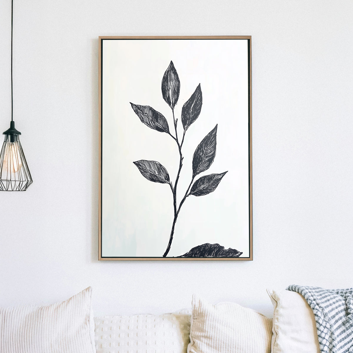 A minimalistic black and white botanical wall art print featuring a delicate hand-drawn branch with leaves, set against a light background