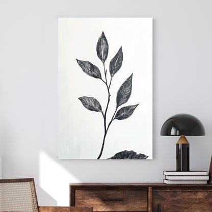 A minimalistic black and white botanical wall art print featuring a delicate hand-drawn branch with leaves, set against a light background