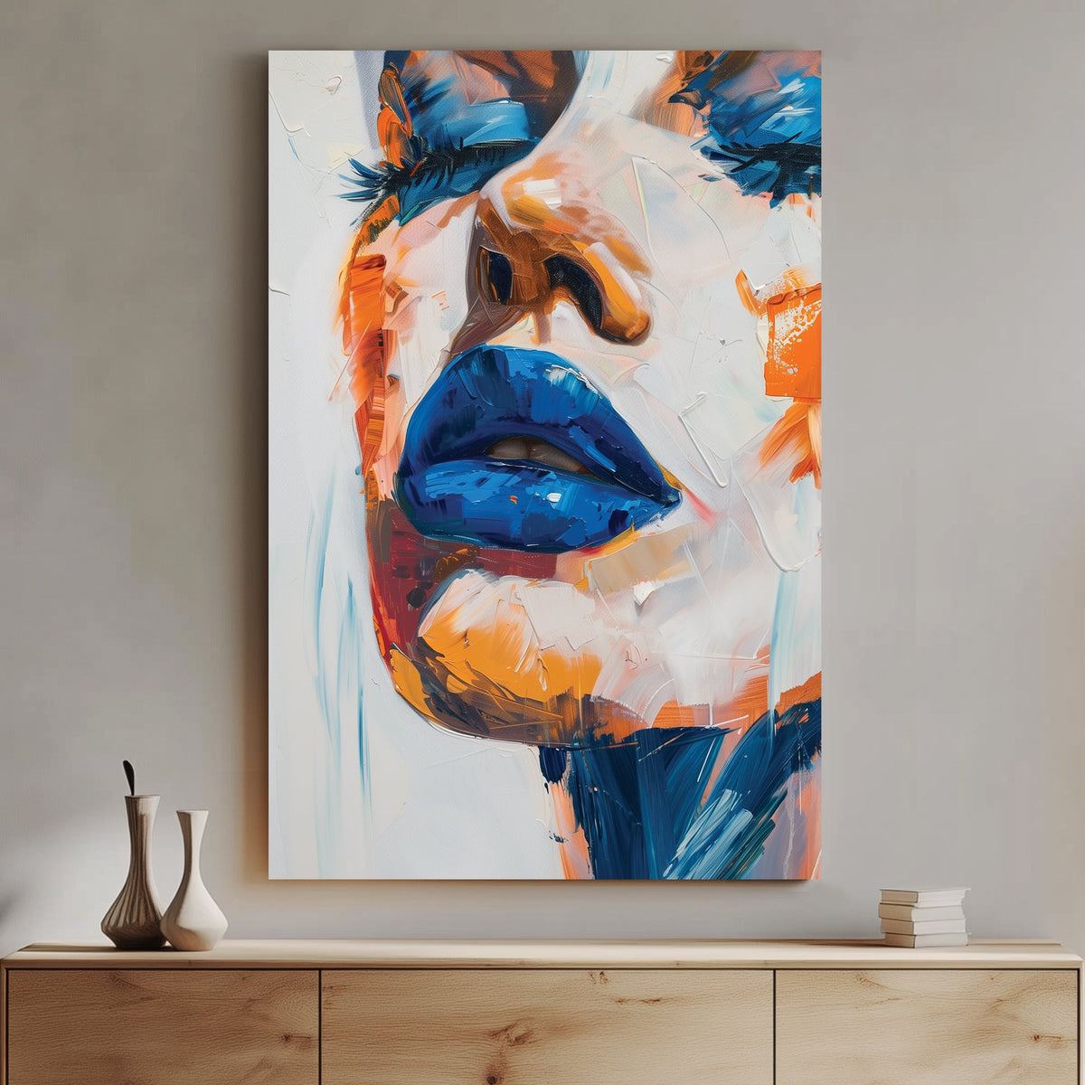 A bold abstract wall art print featuring blue lips with thick, textured paint in orange and peach tones, creating a striking contrast