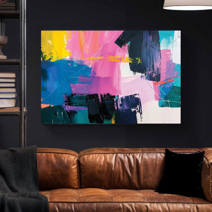 A bold abstract wall art print with layered brushstrokes of pink, blue, yellow, and black, creating a textured and vibrant composition