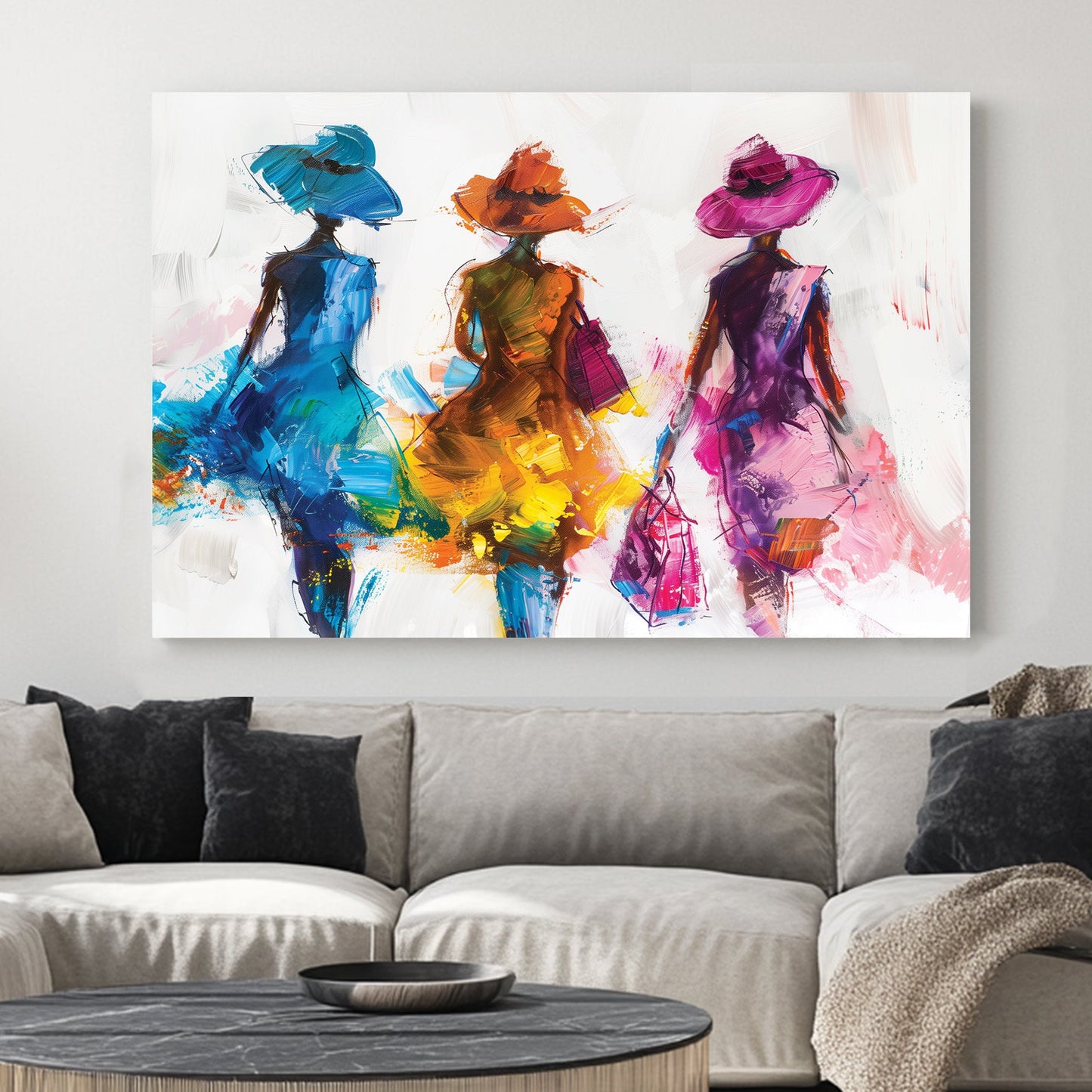 A contemporary wall art print of three stylish women in flowing blue, orange, and pink dresses, depicted with bold brushstrokes and textured layers