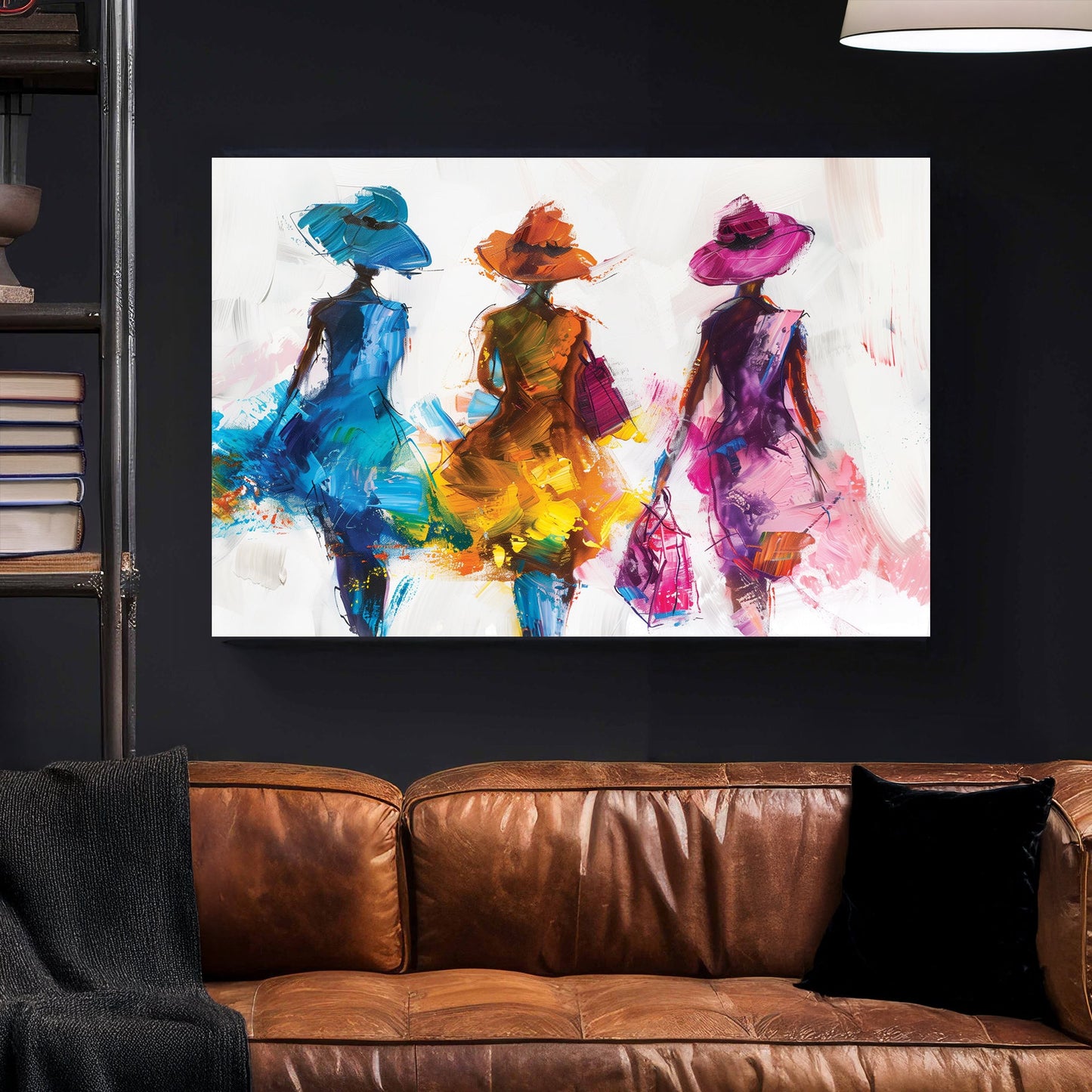 A contemporary wall art print of three stylish women in flowing blue, orange, and pink dresses, depicted with bold brushstrokes and textured layers