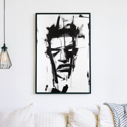 A black-and-white abstract wall art print featuring bold, expressive brushstrokes that create a fragmented and intense facial expression