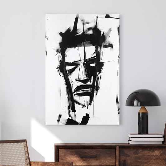 A black-and-white abstract wall art print featuring bold, expressive brushstrokes that create a fragmented and intense facial expression