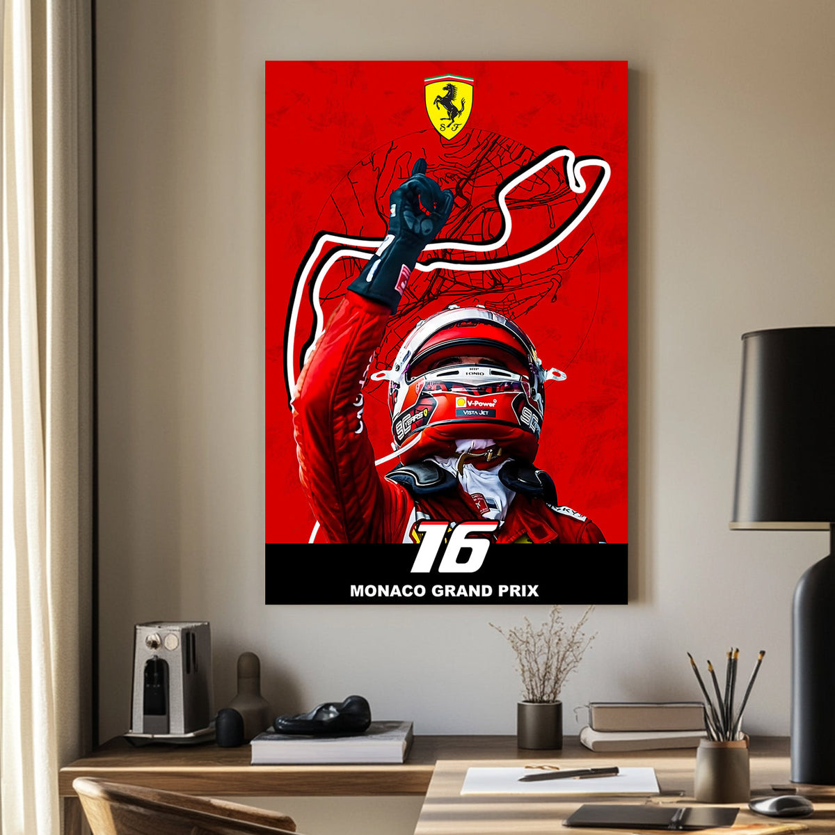 A bold wall art print of a Ferrari driver celebrating victory with a raised hand, set against a red backdrop featuring the Monaco Grand Prix track outline