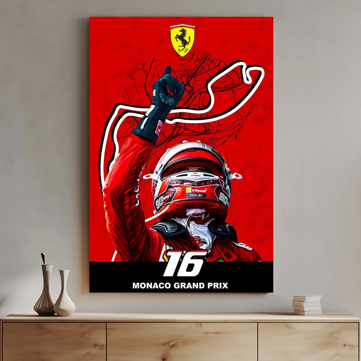 A bold wall art print of a Ferrari driver celebrating victory with a raised hand, set against a red backdrop featuring the Monaco Grand Prix track outline
