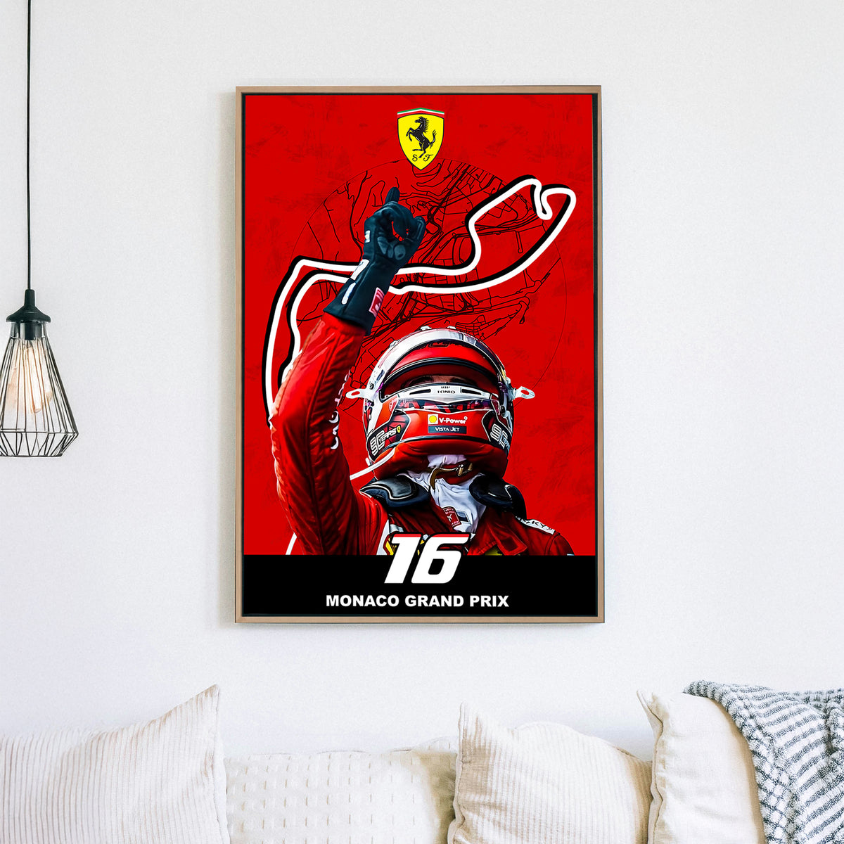 A bold wall art print of a Ferrari driver celebrating victory with a raised hand, set against a red backdrop featuring the Monaco Grand Prix track outline