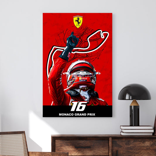 A bold wall art print of a Ferrari driver celebrating victory with a raised hand, set against a red backdrop featuring the Monaco Grand Prix track outline