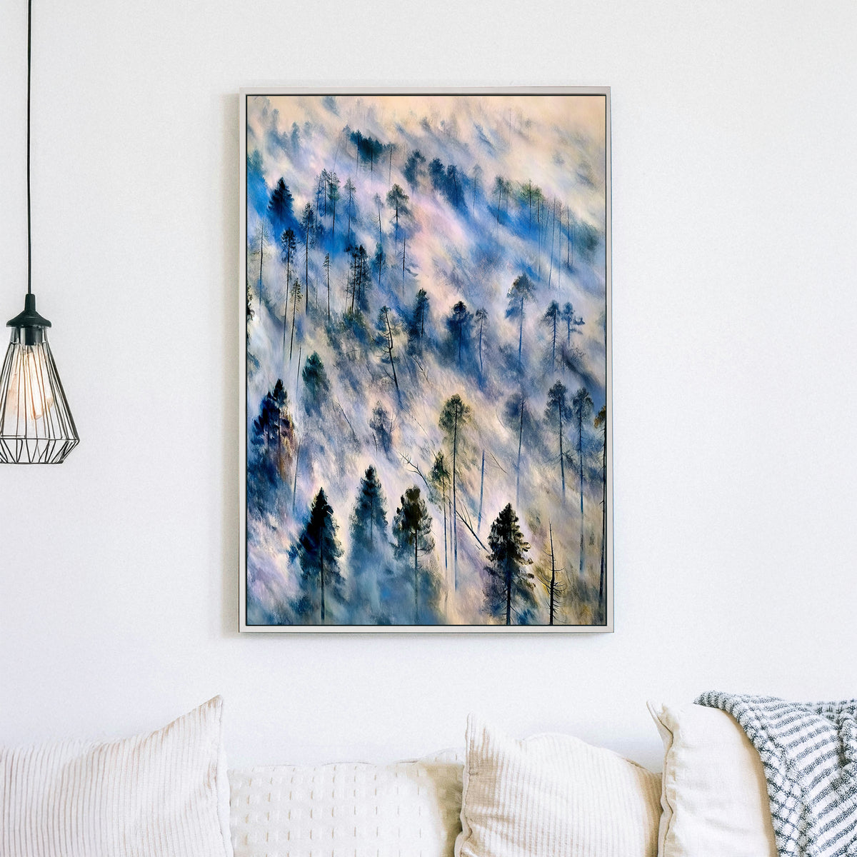 Ethereal landscape wall art of mist-covered pine trees in soft blue, grey, and earth tones, evoking a tranquil forest scene.