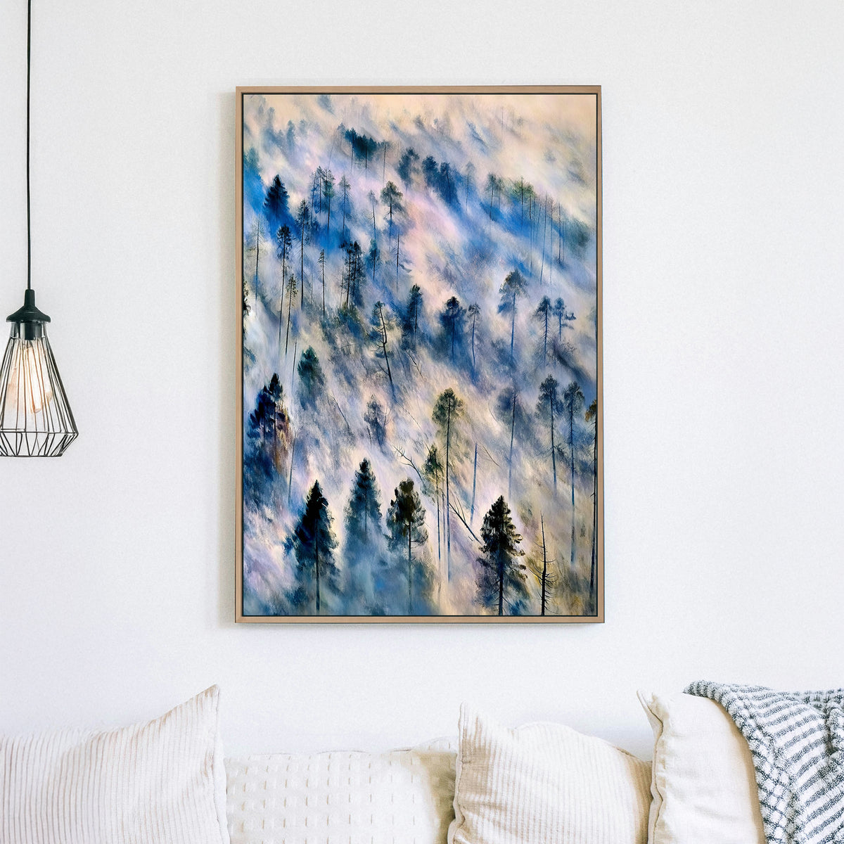 Ethereal landscape wall art of mist-covered pine trees in soft blue, grey, and earth tones, evoking a tranquil forest scene.
