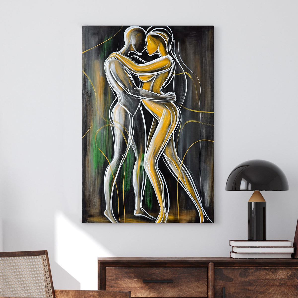 Abstract wall art of two intertwined figures in gold and white outlines against a dark background, symbolizing intimacy and connection.