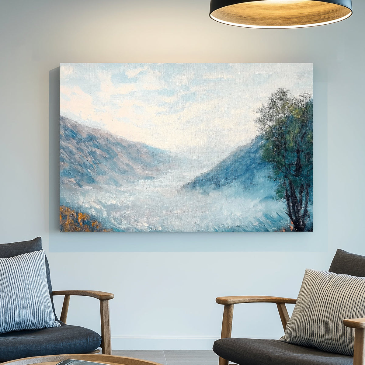 Impressionist wall art of a misty mountain valley with soft blue hues, rolling fog, and a lone autumn tree.