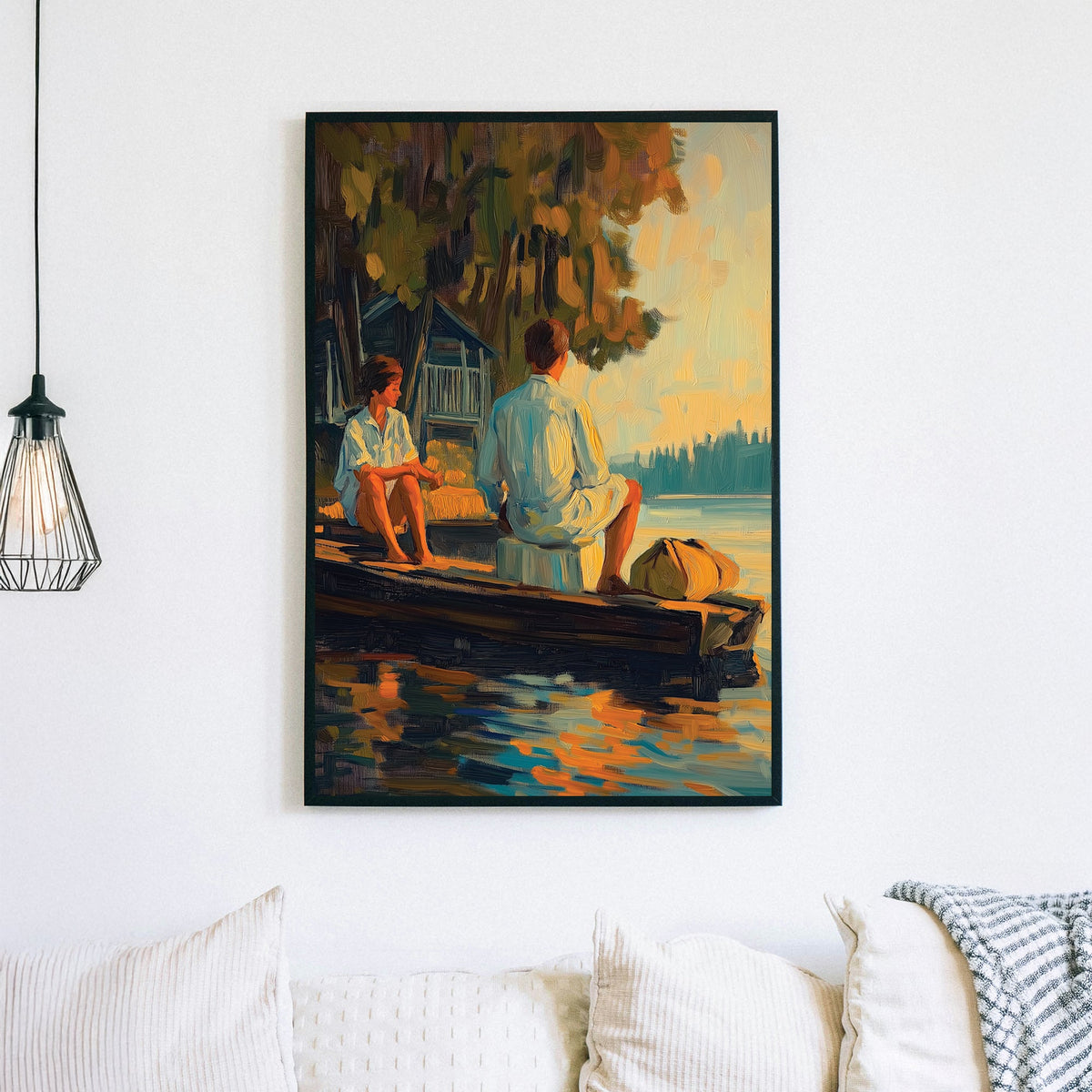 Oil-style wall art of a couple sitting on a wooden dock at sunset, with reflections on the water and a rustic cabin in the background.