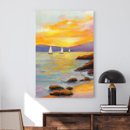 Vivid oil wall art of a sunset over the ocean, with sailboats in the distance and a rocky shoreline in the foreground.