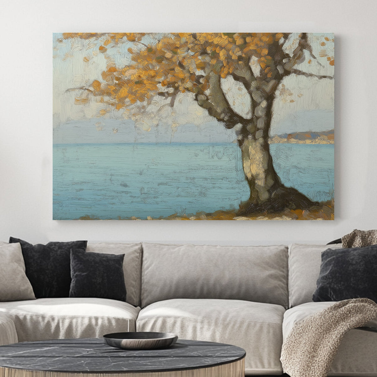 Oil wall art of a golden autumn tree by a peaceful blue shoreline, with textured brushstrokes creating depth and warmth.