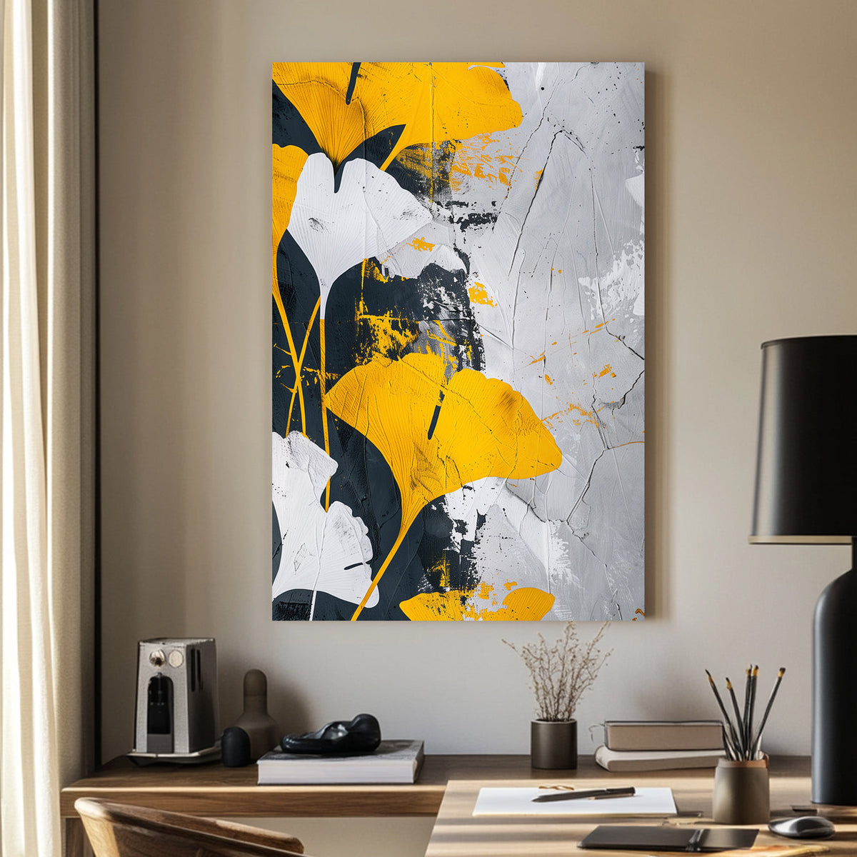 Abstract wall art of golden-yellow ginkgo leaves against a black, white, and grey textured background.