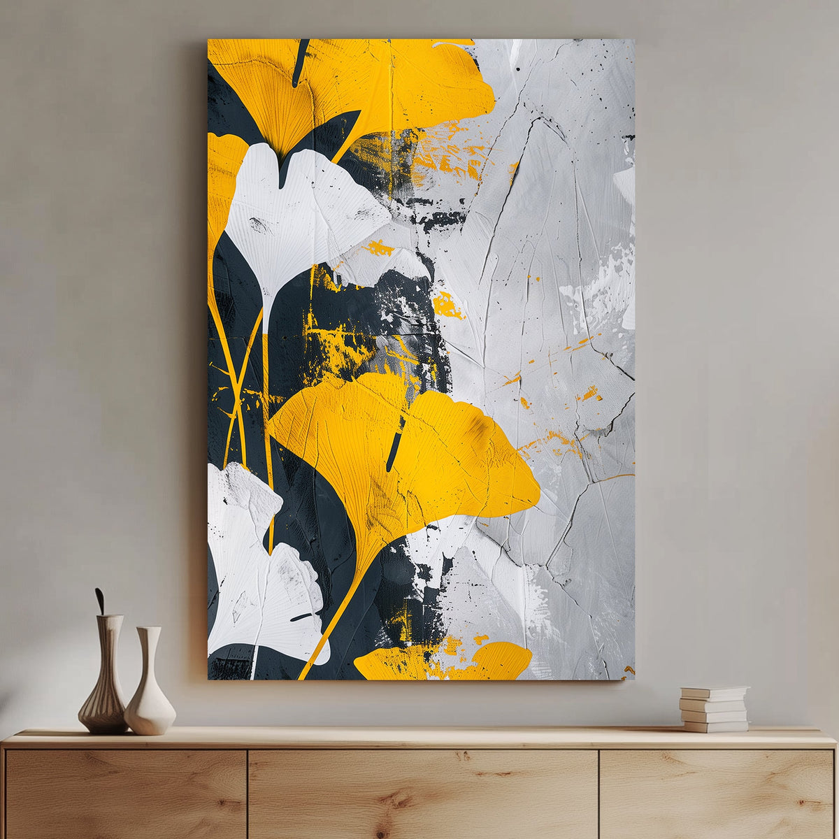 Abstract wall art of golden-yellow ginkgo leaves against a black, white, and grey textured background.