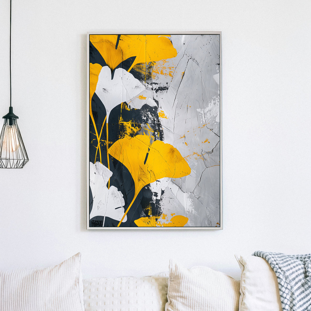 Abstract wall art of golden-yellow ginkgo leaves against a black, white, and grey textured background.