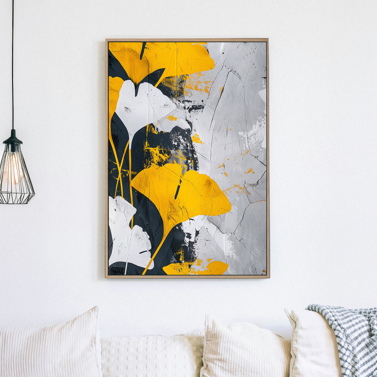 Abstract wall art of golden-yellow ginkgo leaves against a black, white, and grey textured background.