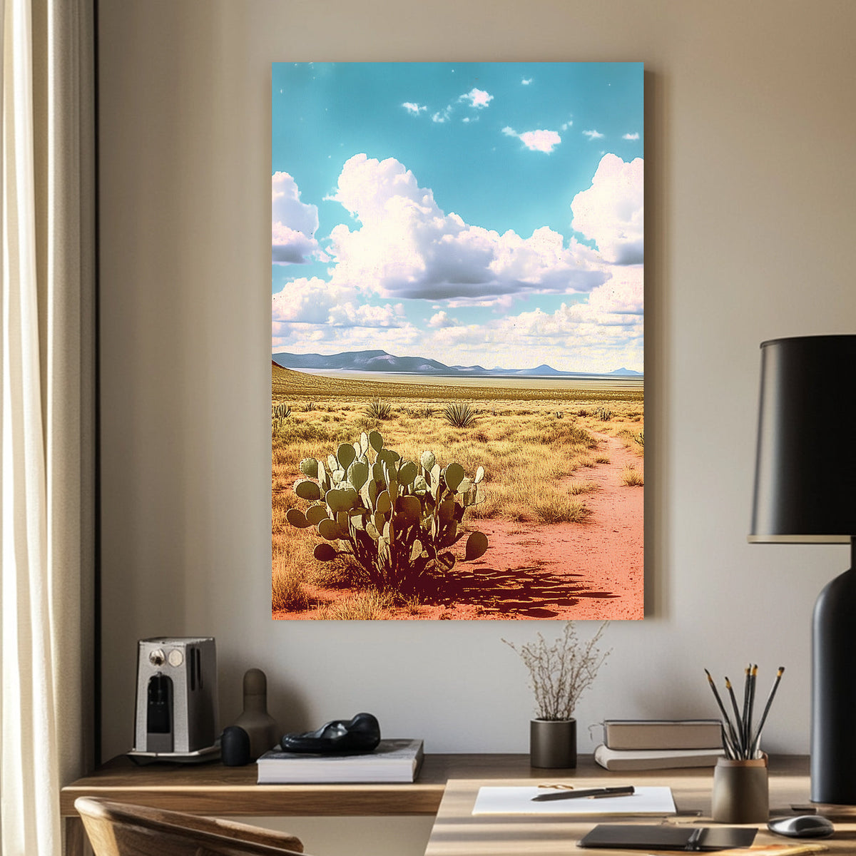 Vintage-style desert landscape with a prickly pear cactus, golden sand, distant mountains, and a vast blue sky filled with fluffy clouds.