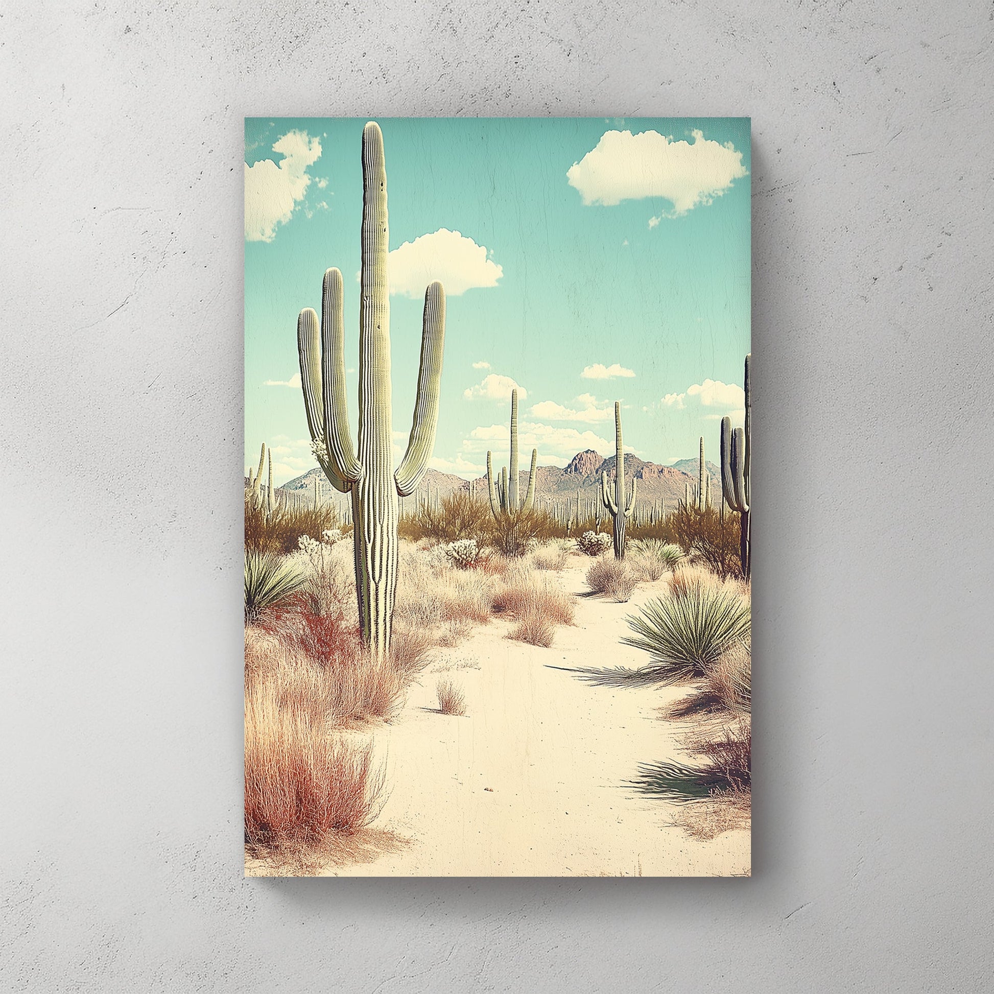 Vintage-style desert landscape featuring towering saguaro cacti, golden sand, and distant mountains under a pale blue sky.