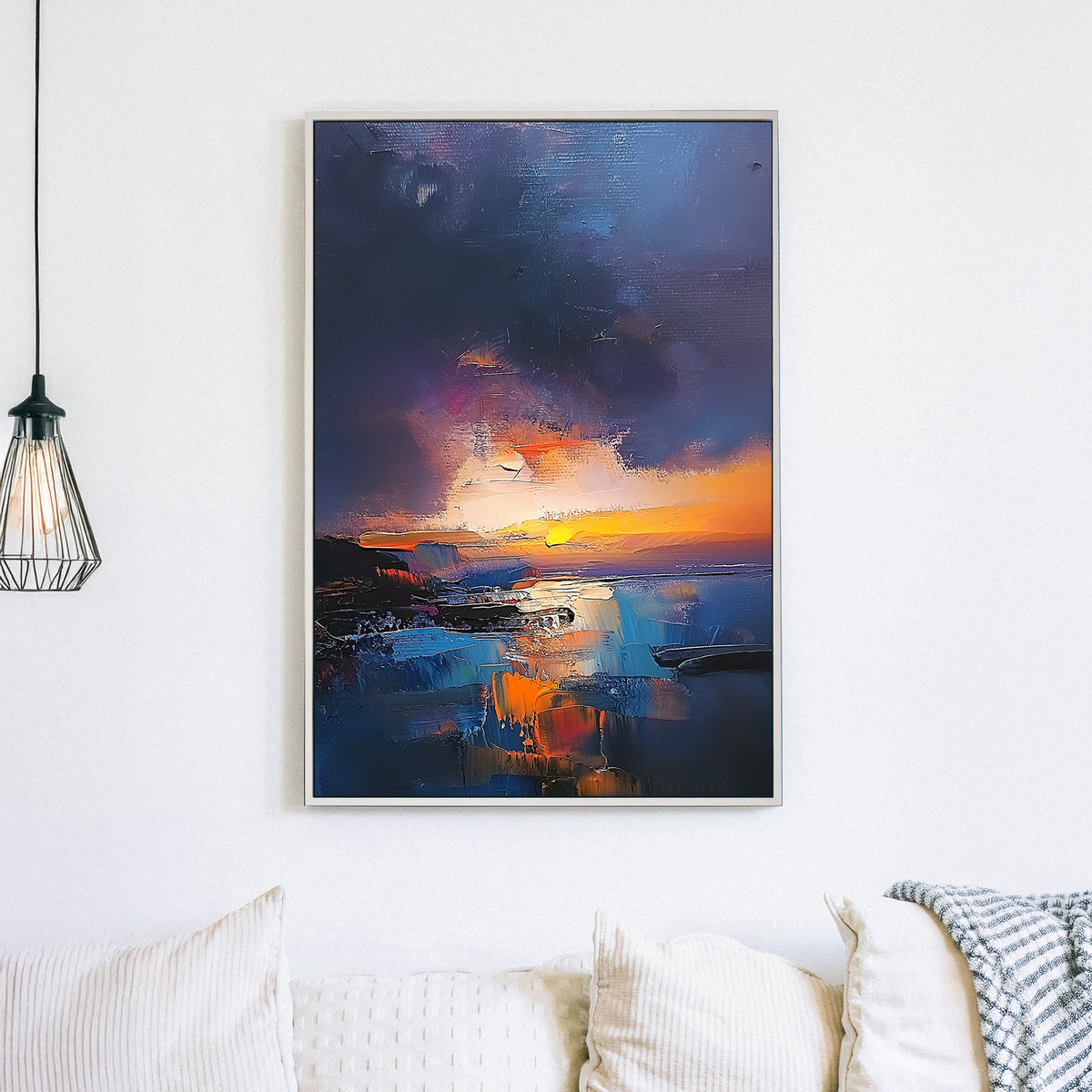 Textured oil wall art of a sunset over a coastal scene with deep blues, fiery oranges, and a moody twilight sky.