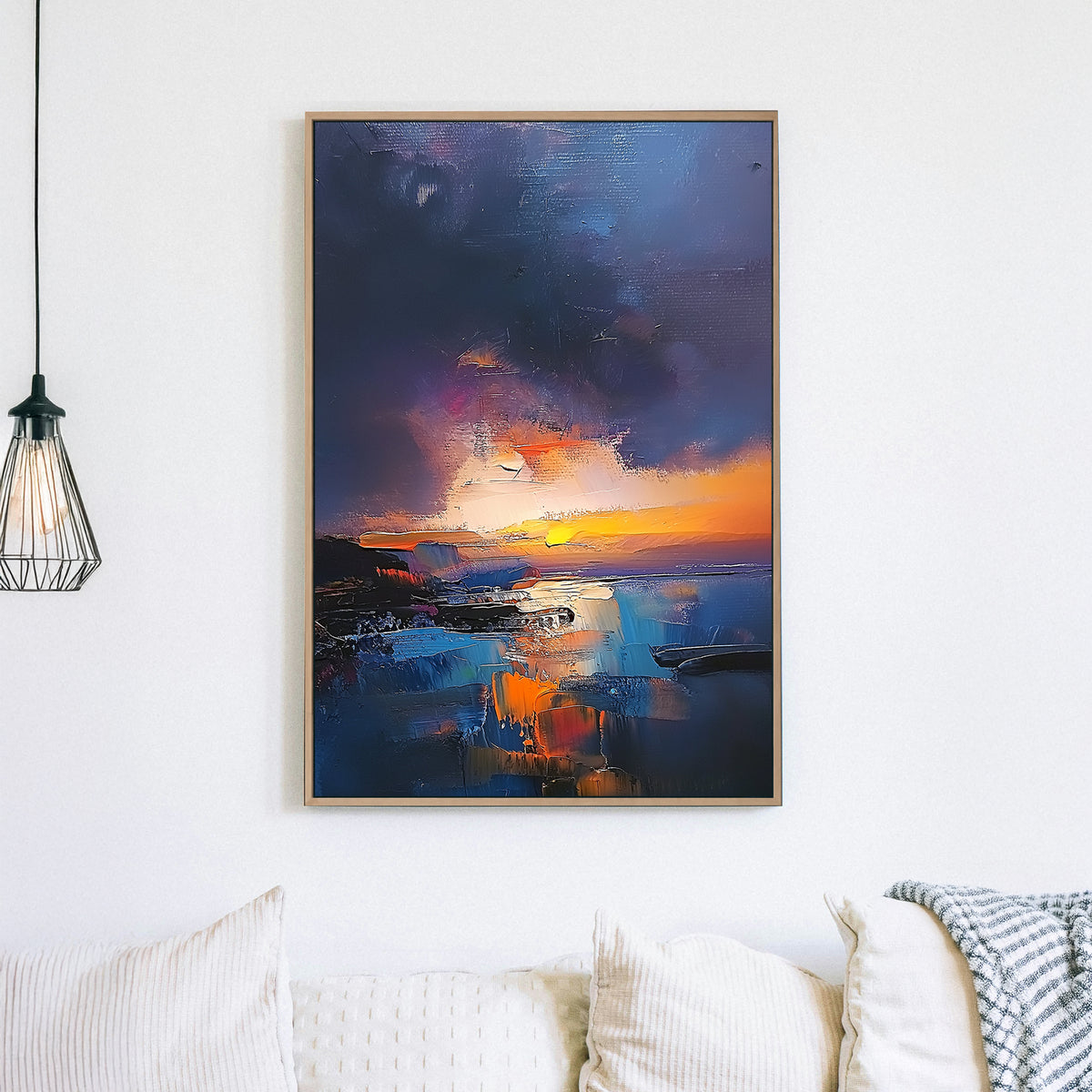 Textured oil wall art of a sunset over a coastal scene with deep blues, fiery oranges, and a moody twilight sky.