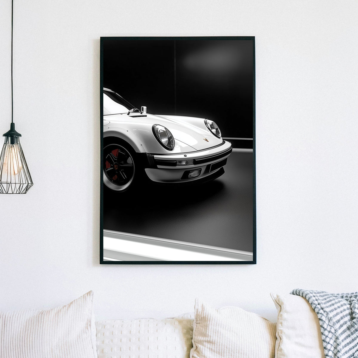 Close-up of a white Porsche 911 against a black background, showcasing its sleek design and iconic headlights.