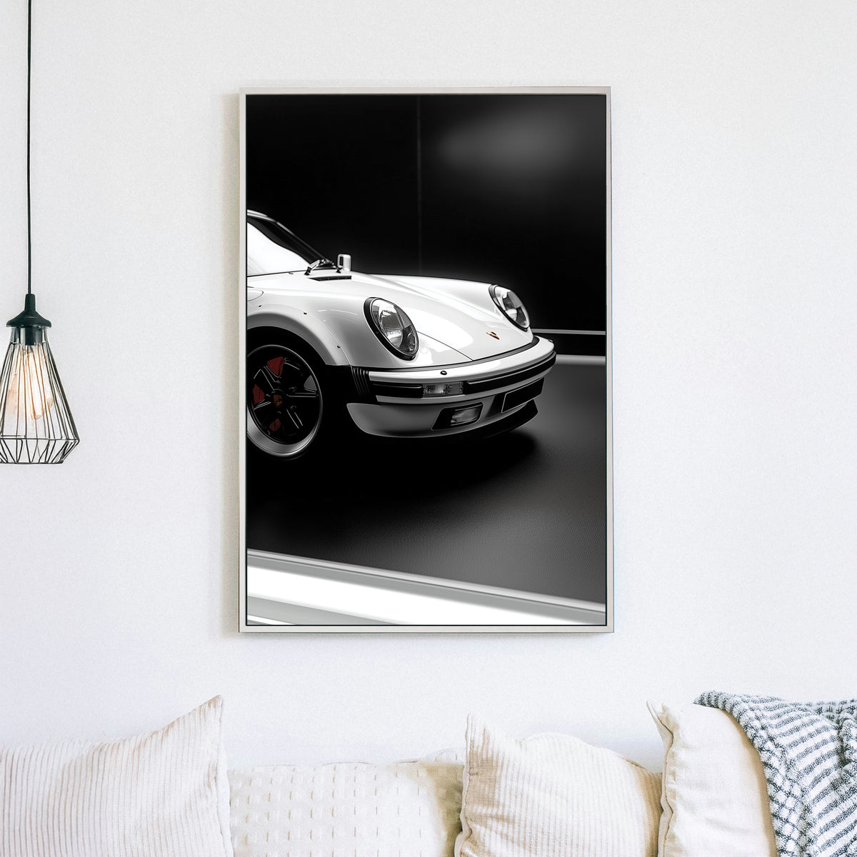 Close-up of a white Porsche 911 against a black background, showcasing its sleek design and iconic headlights.