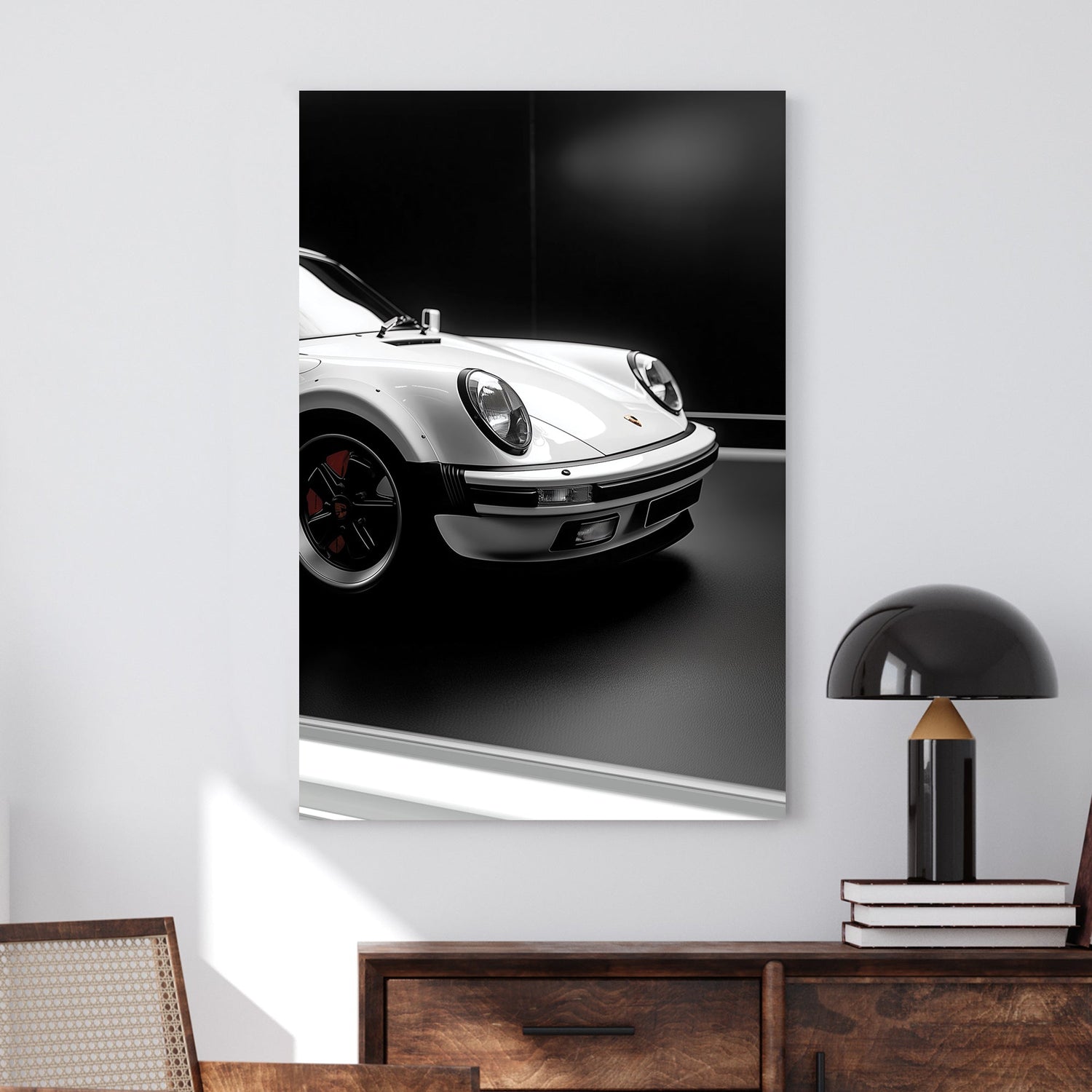 Close-up of a white Porsche 911 against a black background, showcasing its sleek design and iconic headlights.