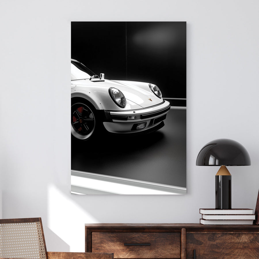 Close-up of a white Porsche 911 against a black background, showcasing its sleek design and iconic headlights.