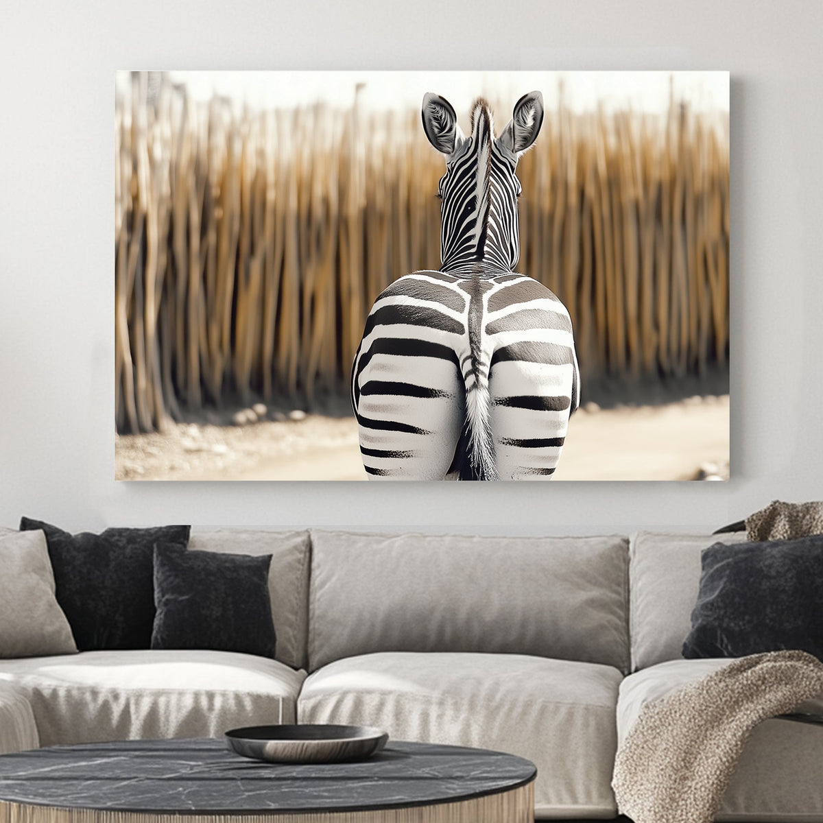 Zebra seen from behind, showcasing bold black-and-white stripes against a blurred, warm-toned background.