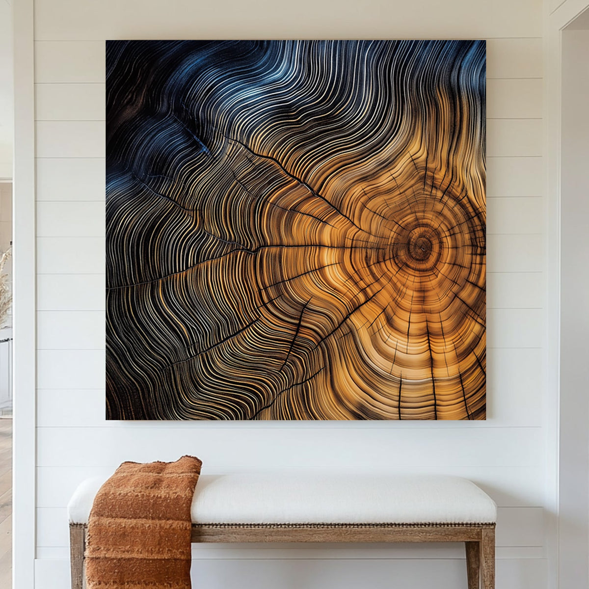 Close-up of a tree cross-section with detailed growth rings in warm golden and deep blue tones.