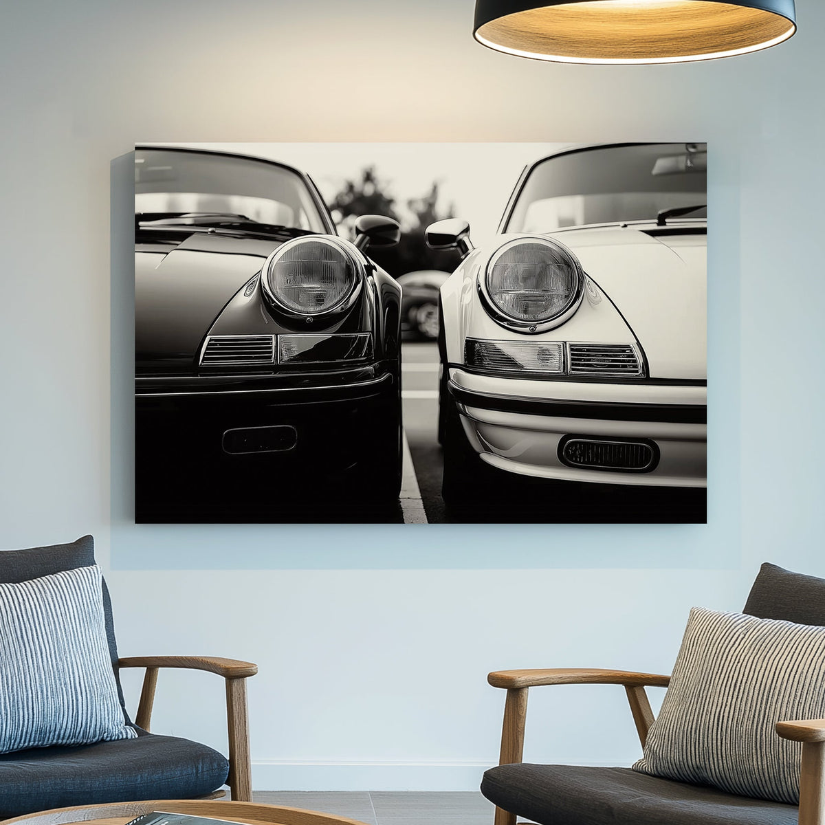 Black and white wall art featuring two vintage Porsche 911 cars parked side by side in a striking monochrome composition.