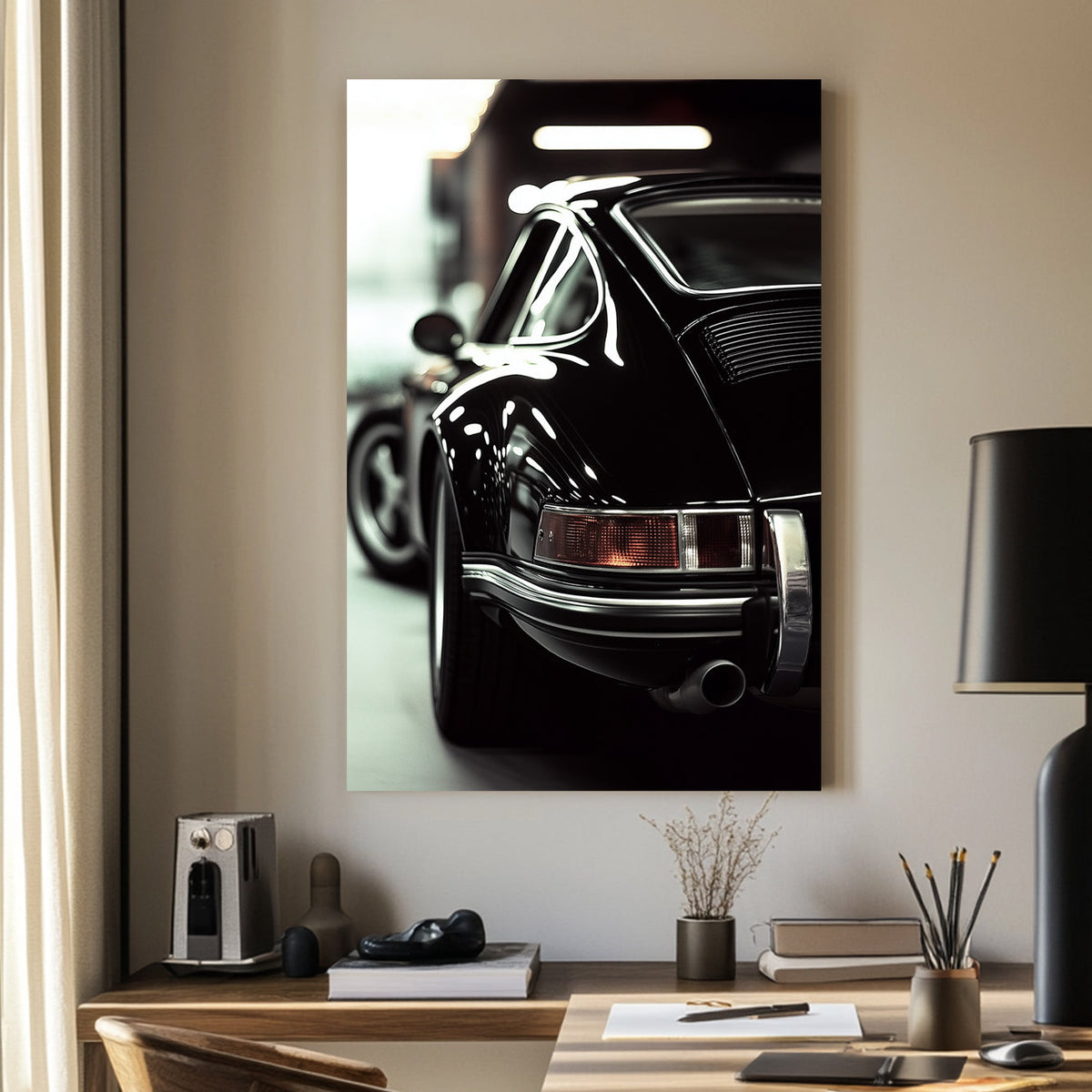 Close-up of a classic black Porsche with reflective chrome details in a dimly lit garage.
