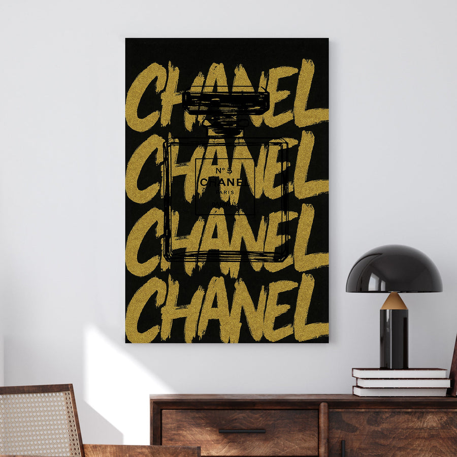 Chanel No. 5 perfume bottle sketch over bold gold Chanel lettering wall art