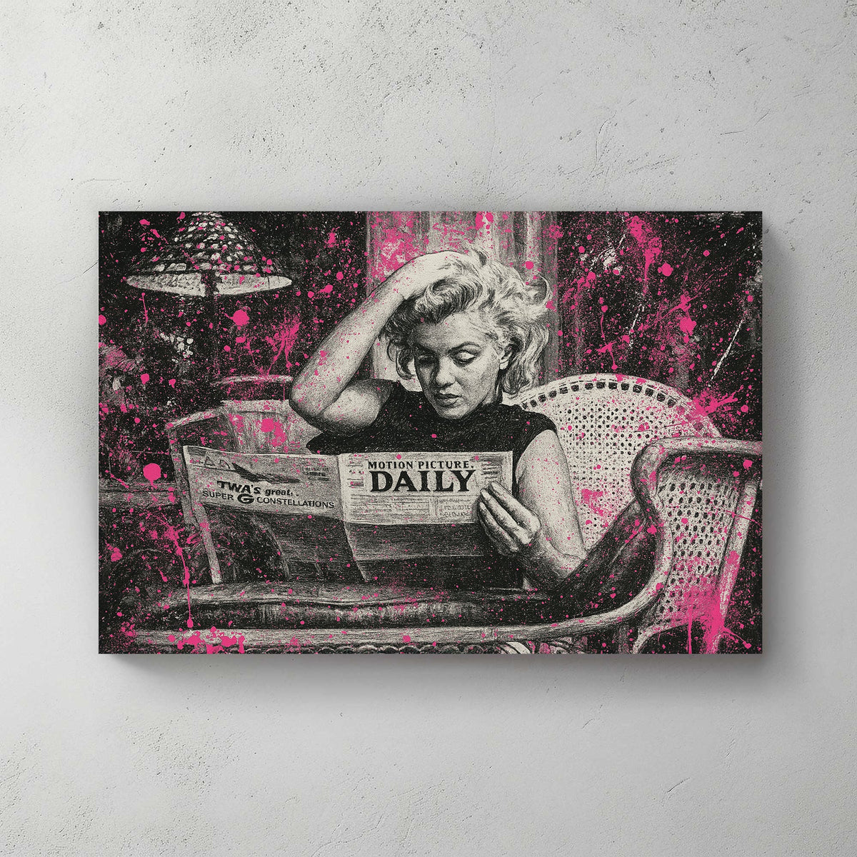 Marilyn Monroe reading newspaper in black and white with pink paint splatter wall art