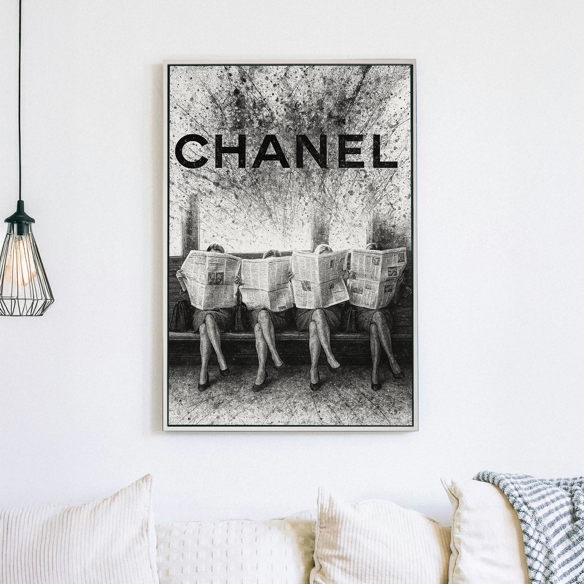 Chanel fashion-inspired wall art with women reading newspapers in black and white