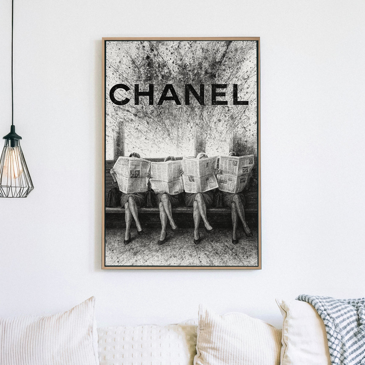Chanel fashion-inspired wall art with women reading newspapers in black and white