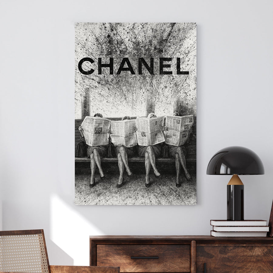 Chanel fashion-inspired wall art with women reading newspapers in black and white