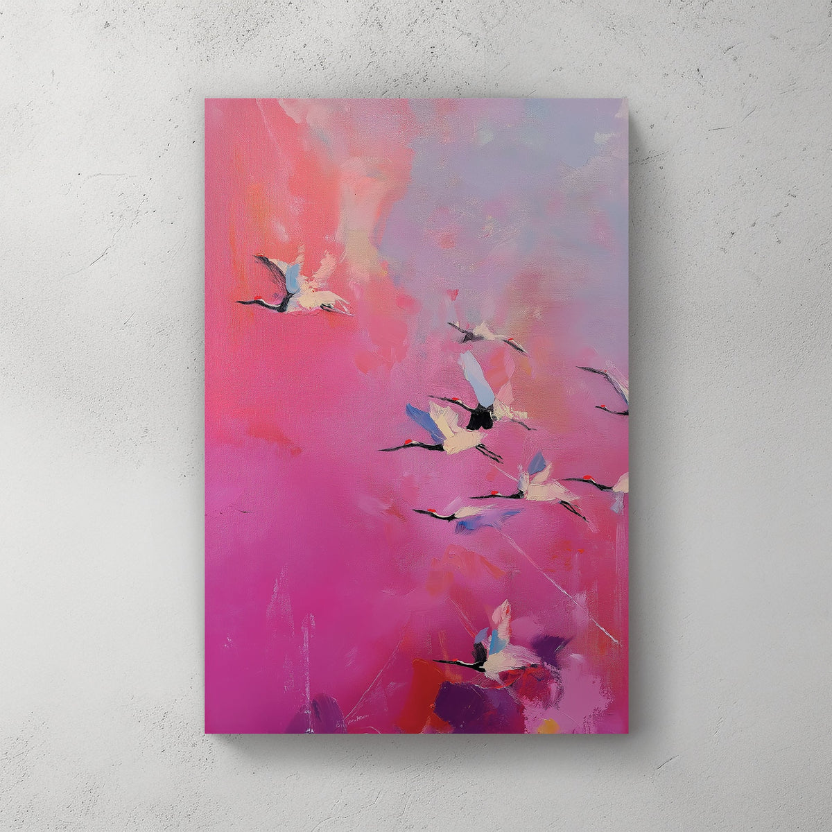 Pink and purple wall art of flying cranes in a dreamy sky