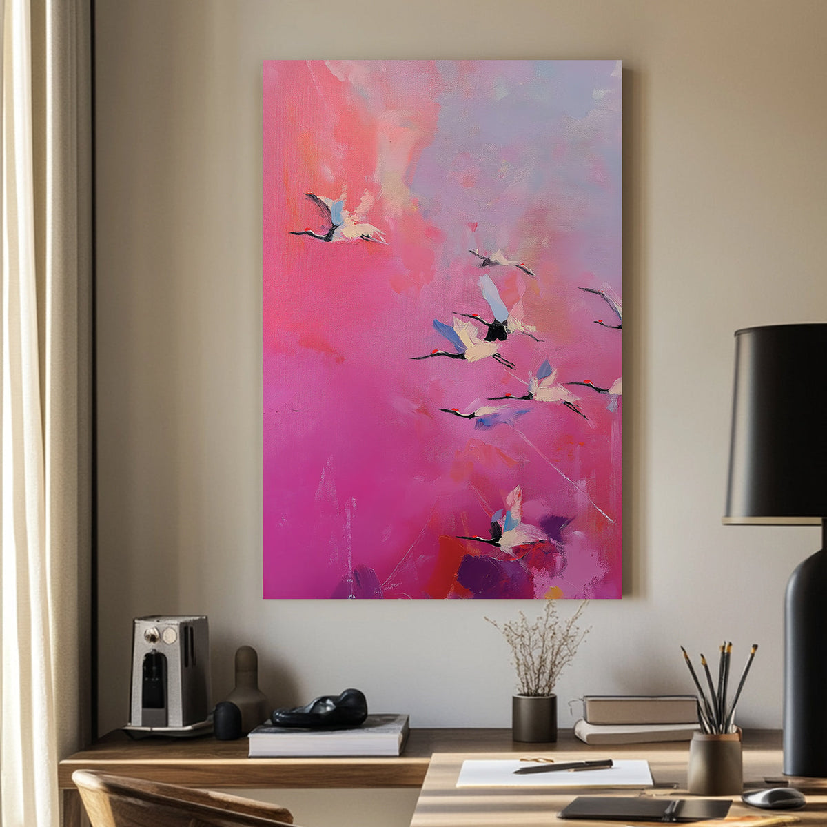 Pink and purple wall art of flying cranes in a dreamy sky