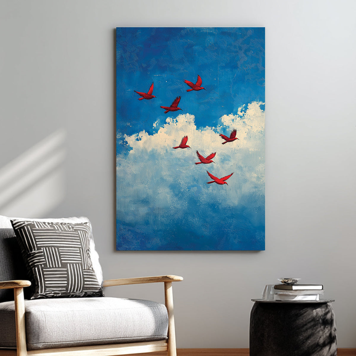 Wall art of red birds flying across a blue sky with textured white clouds