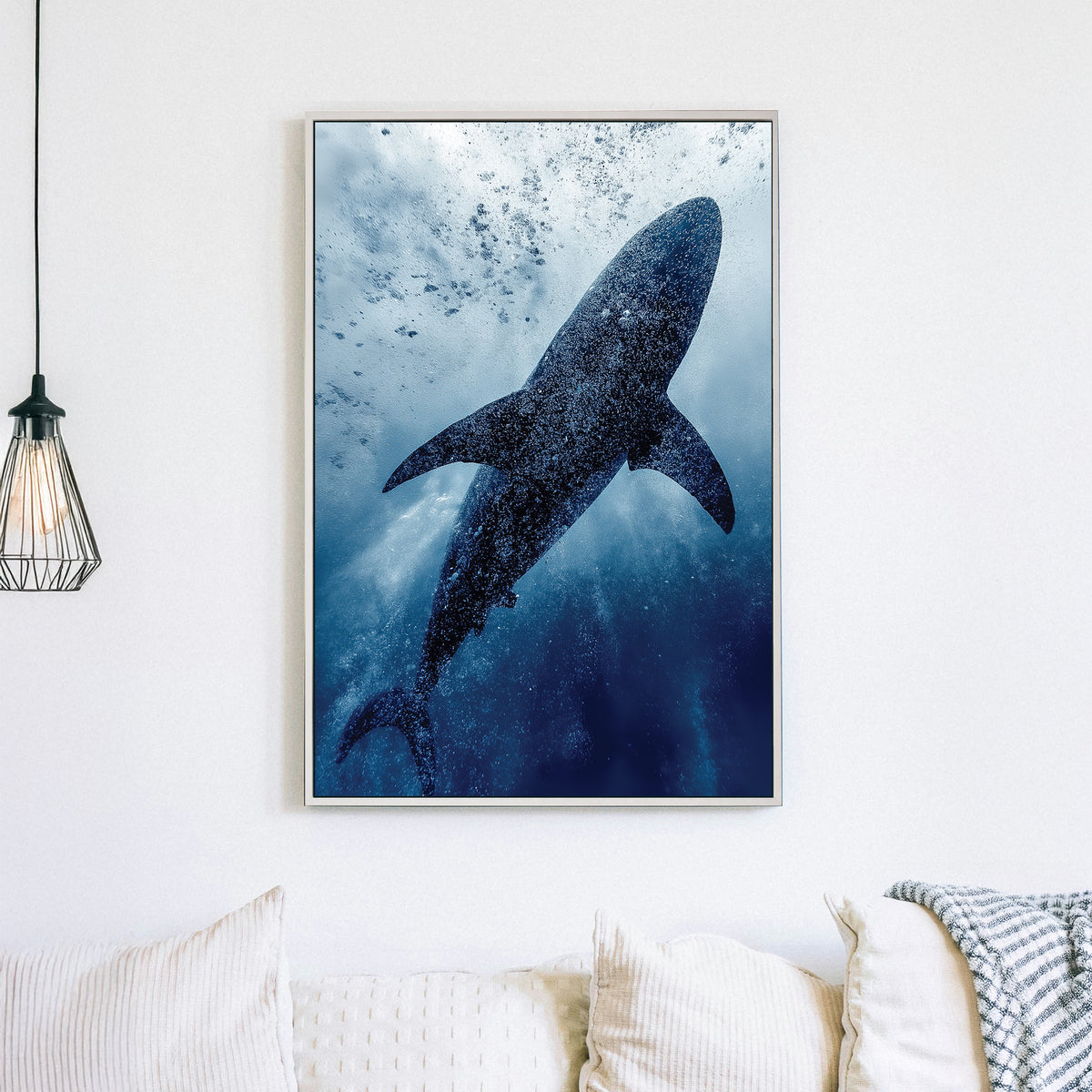 Wall art of a shark swimming underwater surrounded by bubbles