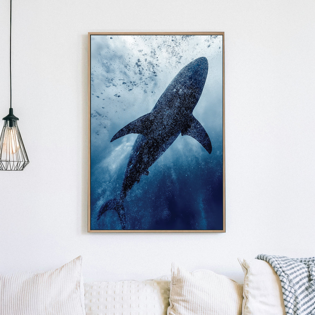 Wall art of a shark swimming underwater surrounded by bubbles